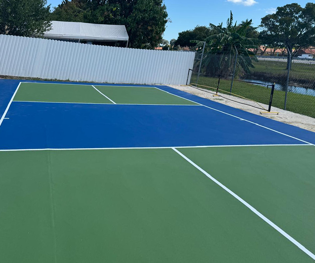 Outdoor blue and green tennis court.